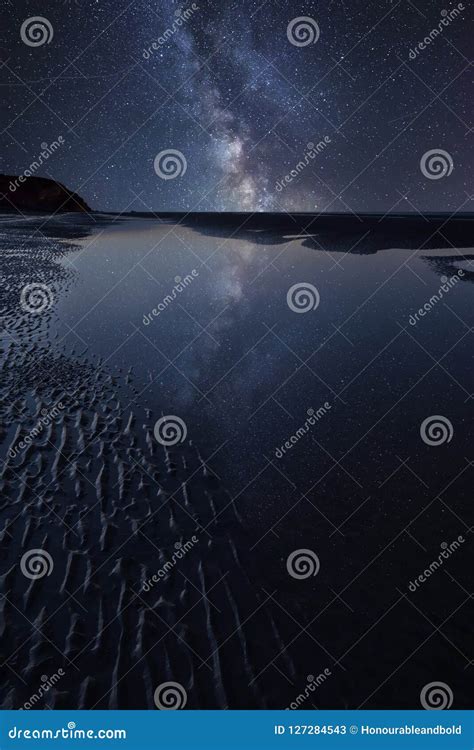 Vibrant Milky Way Composite Image Over Landscape Of Low Tide Be Stock