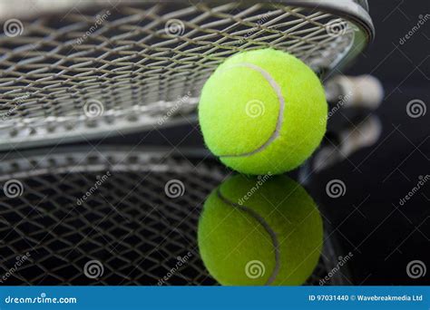 Close Up Of Tennis Racket On Ball With Reflection Stock Photo Image