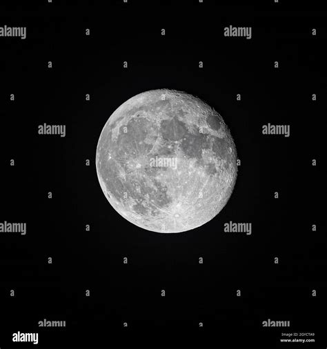 A Bright Full Moon Isolated In The Black Night Sky Stock Photo Alamy