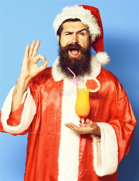 Handsome Bearded Santa Claus Man With Long Beard On Funny Face Holding