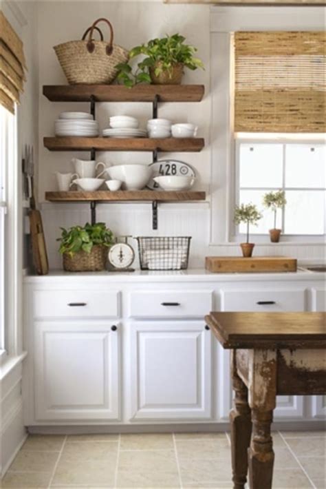 Adding shelves versus a traditional wall cabinet can allow you to save money on expensive cabinets. Get This Look: Open Kitchen Shelves - The Honeycomb Home