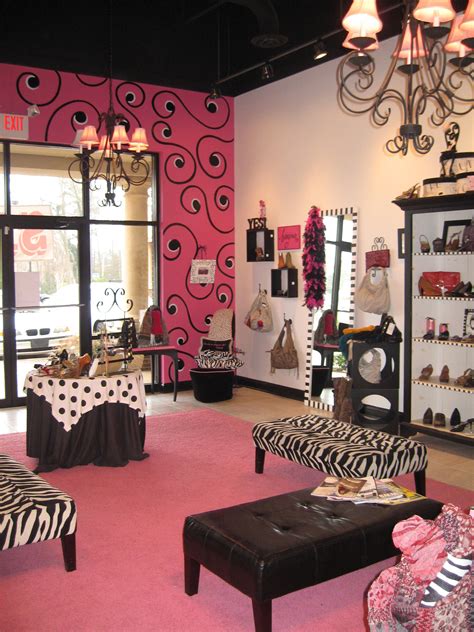 A Pink And Black Room With Zebra Print Furniture