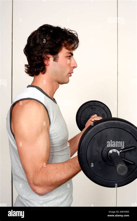 Young Man Lifting Weights Stock Photo Alamy