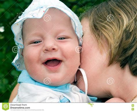 Mother Kissing Laughing Baby Stock Image Image Of Cute Infant 3135633