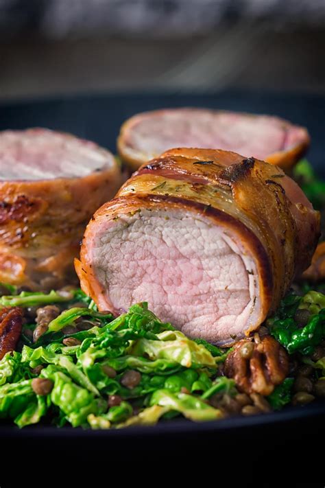 Now put some water on the bottom of pan to catch the grease. Bacon Wrapped Pork Tenderloin With Cabbage and Lentils ...
