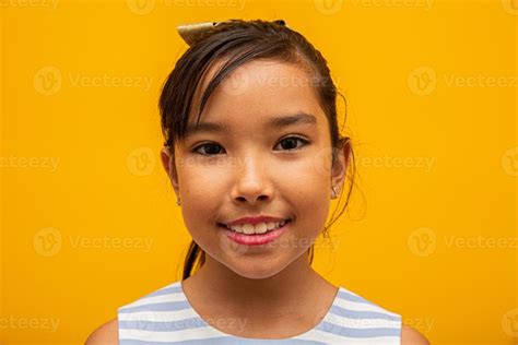 Beautiful Asian Girl Sitting On Yellow Background Happy Little Asian