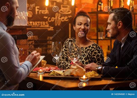 Couple Talking To Bartender Behind Bar Counter In A Cafe Stock Image Image Of Black Dating