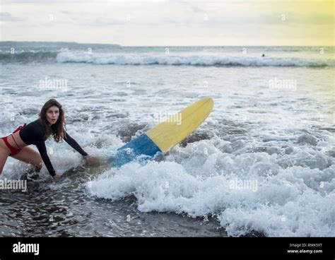 Young Girl In Bikini Surfer With Surf Board Dive Underwater With Fun