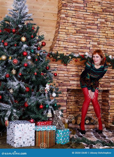 Beautiful Blonde Model In Minidress Posing Near Christmas Tree Stock Photo Image Of Face