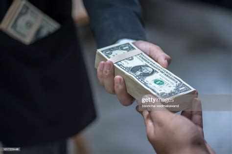Businessman Giving Money To His Partner Payment Loan And Bribery