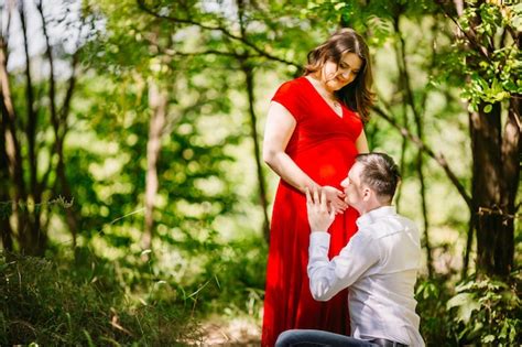 Free Photo The Husband With Pregnant Wife Embracing In The Forest