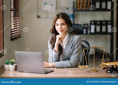 Beautiful Asian Woman Lawyer Working And Gavel Tablet Laptop In Front