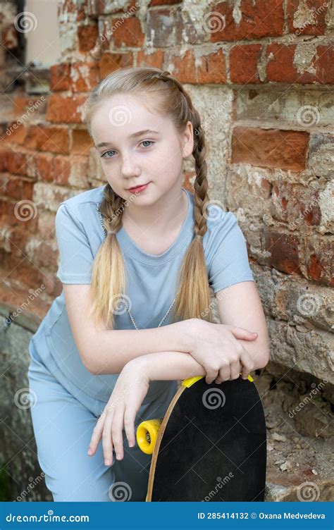 A Girl With A Skateboard Portrait Of A Romantic Girl 13 15 Years Old