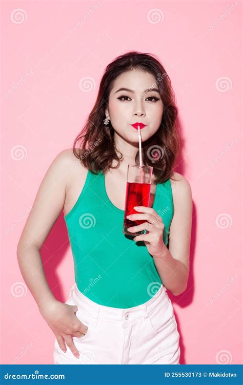 Beautiful Girl Drinking A Cocktail Against Pink Background Stock Image Image Of Cocktail