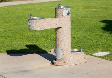 Premium Photo Concrete Drinking Fountain In Park