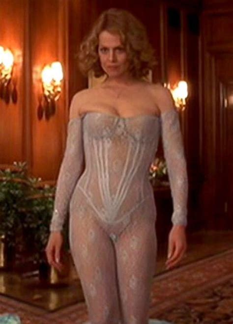 A Woman In A Bodysuit Standing On A Rug