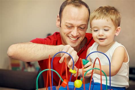 Father Playing With Child In Developing Game Stock Photo Image Of
