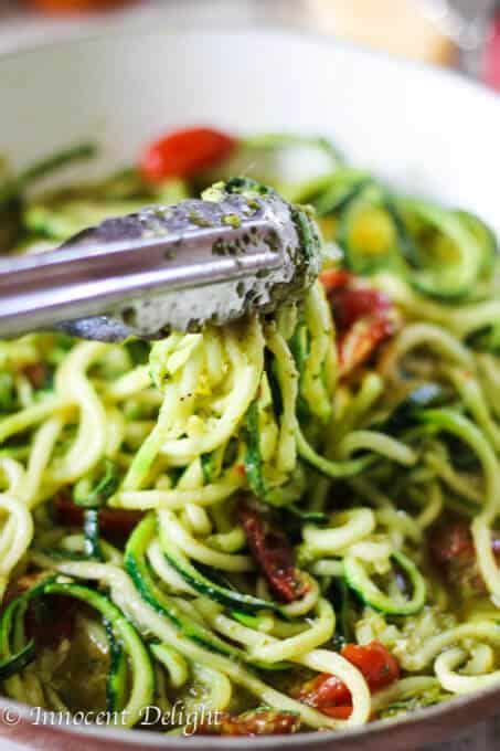 When you buy through links on our site, we may earn an affiliate commission at no additional cost to you. Pesto Zucchini Noodles with Cherry Tomatoes - Eating European