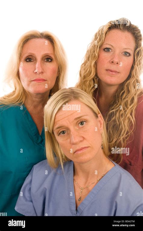 group of three pretty nurses or doctors or medical professionals wearing nurse s scrub clothes