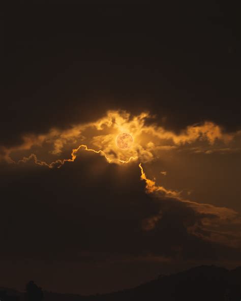 Sun Covered By Clouds During Night Time Photo Free Flare Image On