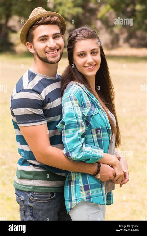 Young Couple Hugging In The Park Stock Photo Alamy