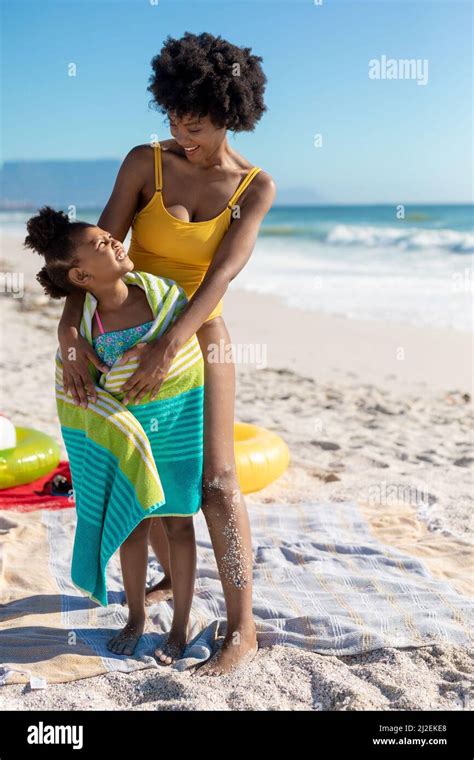 Happy African American Mother And Daughter Looking At Each Other While