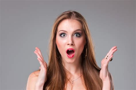Free Photo Close Up Portrait Of Surprised Beautiful Woman Holding Her