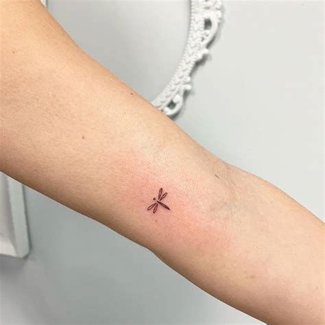 Tiny Dragonfly Tattoo On The Inner Arm