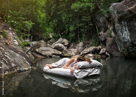 A Hidden Place Sleeping Woman In Deep Forest Lies On Airbed Stock Foto Adobe Stock