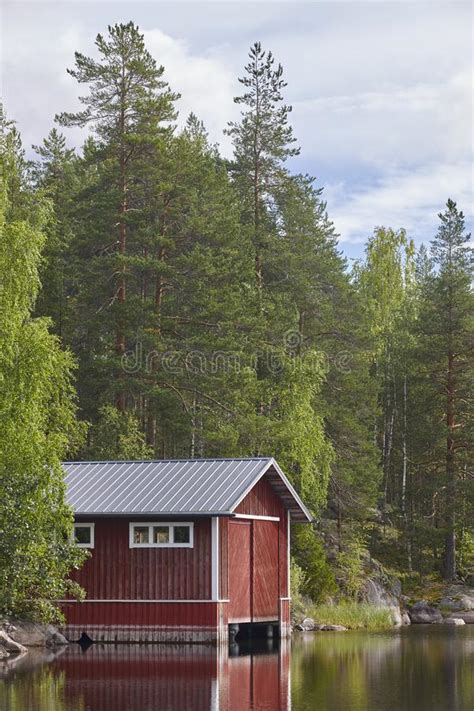 Finland Landscape Forest Lake And Red Wooden Cabin Summer Stock Photo