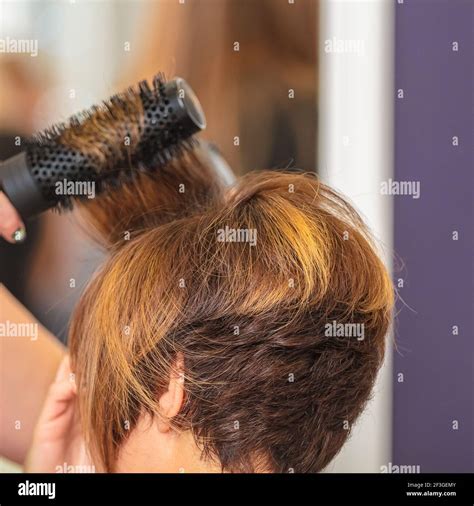 Woman Makes Hair By Comb In Beauty Salon Short Haircut Stock Photo Alamy