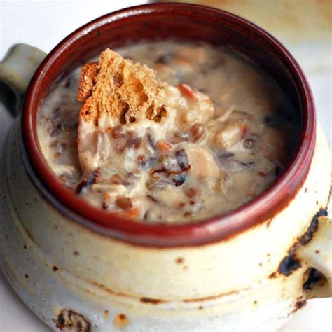 Whisk in soup and wine. Chicken Bacon Wild Rice Soup Recipe - Pinch of Yum