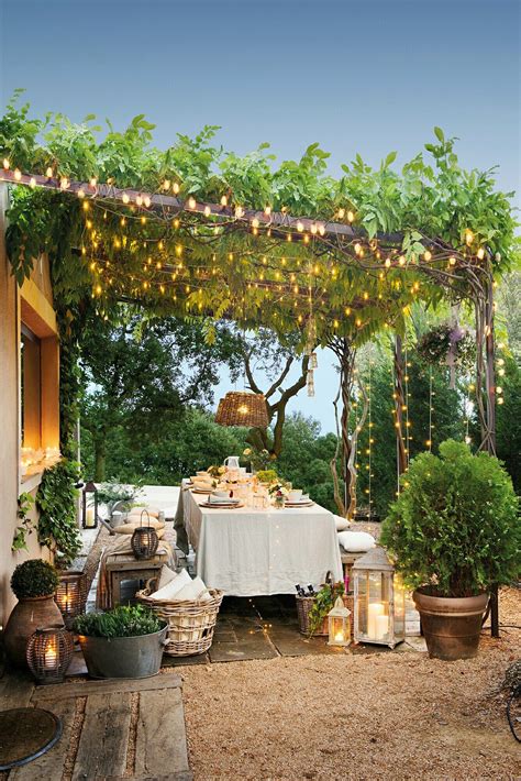 Outdoor Dining Area Under A Vine Covered Pergola With