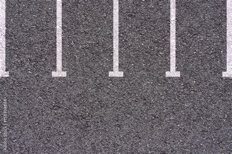 Parking Lot White Lines On Asphalt Background Texture Stock Photo