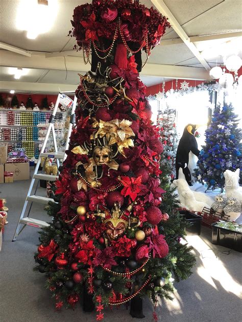 Achieve the mysterious appeal essential for any masquerade themed event with elegant props and décor from anderson's. Venetian Christmas tree. Masquerade themes with burgundy ...