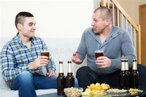 Two Men Drinking Beer Stock Photo Image Of Indoor Home 74595332