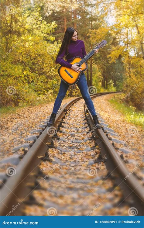 Beautiful Girl With Acoustic Guitar In Autumn Park Stock Image Image