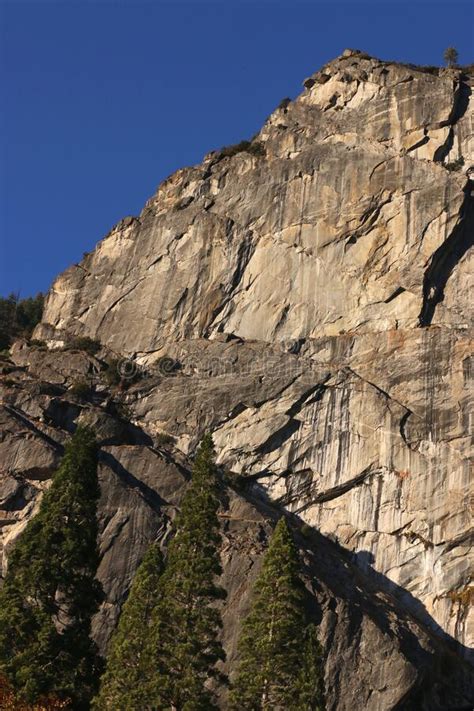 Sheer Granite Cliffs Against A Blue Sky Yosemite National Park Stock
