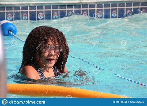 Multi Racial Tween Girl In Pool With Goggles On Stock Photo Image Of