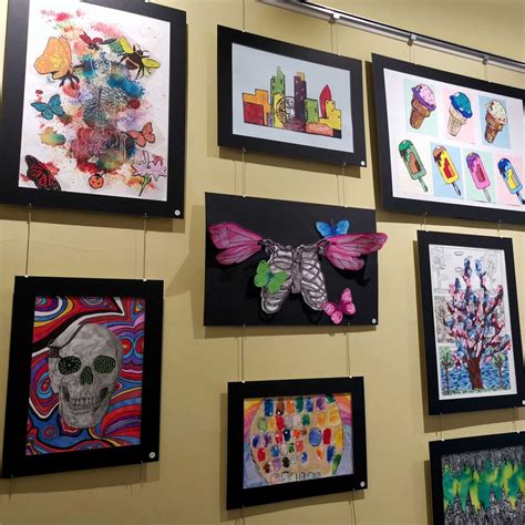 Student Artwork On Show For The Public At A Summer Art Exhibition