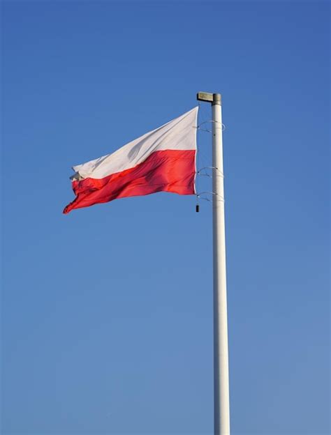 Premium Photo Polish Flag Waving In The Sky Waving National Flag Of