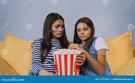 mother and daughter watching movie near stock image image of unhealthy home 211275255