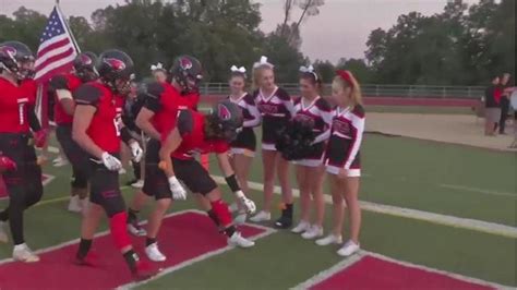 High School Cheerleader Battling Cancer Receives Support From Football Team