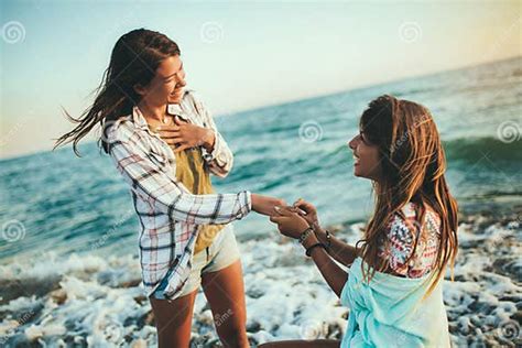 Girl Has A Fun With Her Girlfriend On The Beach Stock Image Image Of