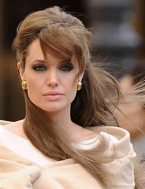Shiloh is the perfect mixture of her famous parents — with piercing blue eyes, a beaming smile, and a gorgeous head of blonde hair. 55 Fantastic Hairstyles Of Angelina Jolie