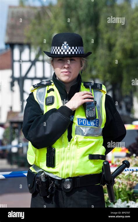 Front View Of Wpc Woman Police Officer Guarding A Crime Scene In Hereford City Centre Uk