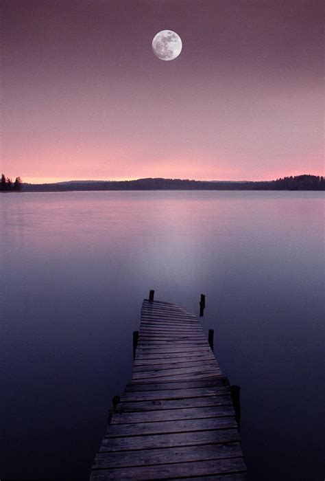 Moon Over Lake With Pier At Dusk By Grant Faint