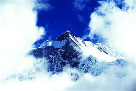 Above The Clouds Of A Mountain Peak In The Himalayas Premium Image By