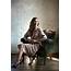 Elegant Woman In Classic Trench Coat Posing Armchair  Stock Photo