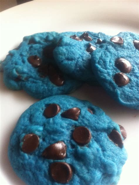 Three Blue Chocolate Chip Cookies On A White Plate